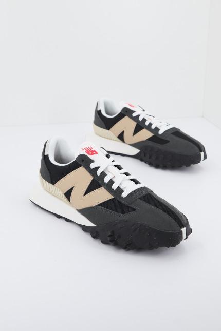 NEW BALANCE UXC RN en color GRIS (1)