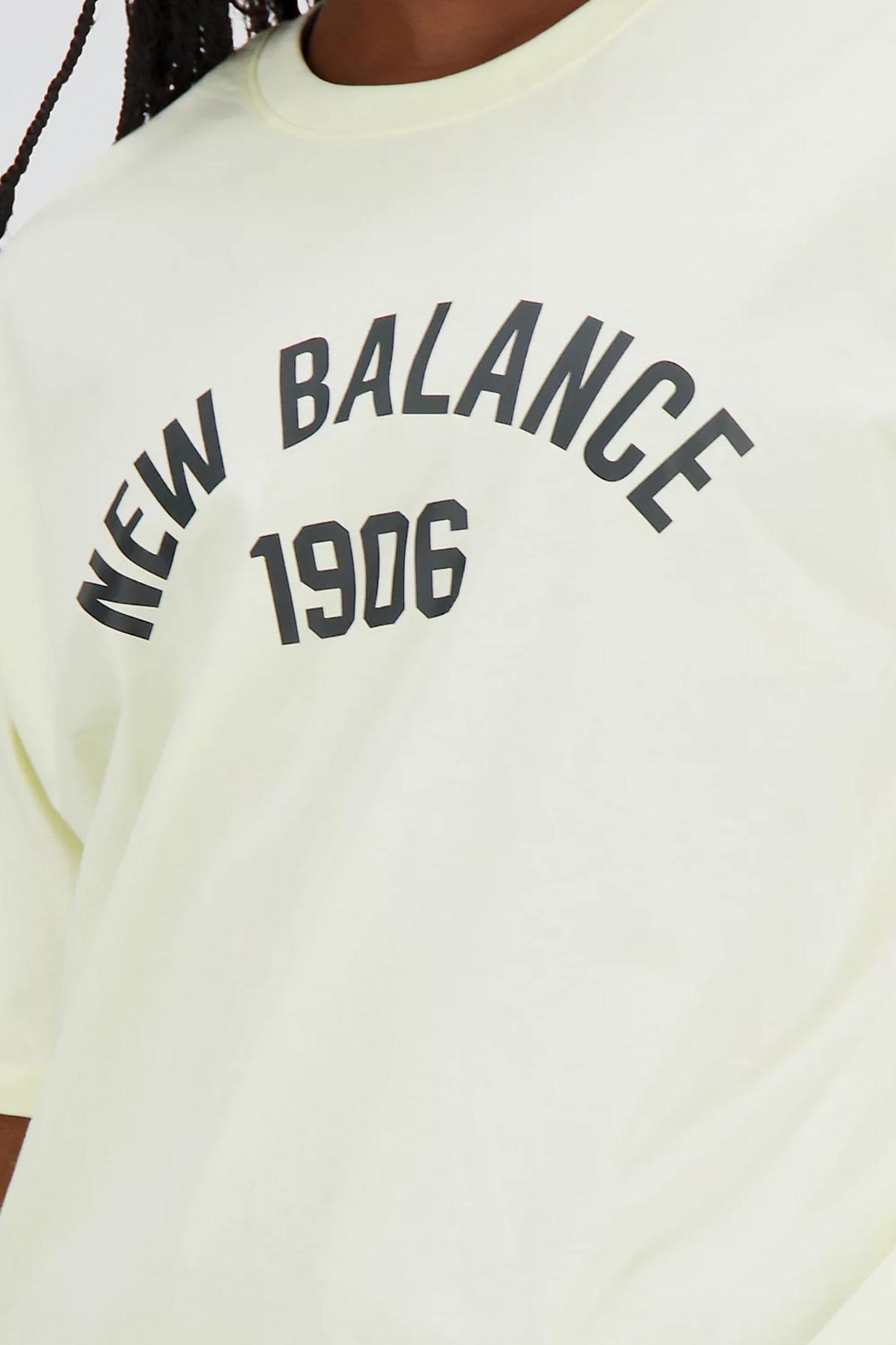 NEW BALANCE ESSENTIALS VARSITY TSHIRT en color AMARILLO (4)